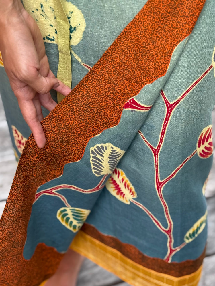 
            
                Load image into Gallery viewer, Daun Jati Linen Sarung Ikat (Greenish-Blue &amp;amp; Brown)
            
        